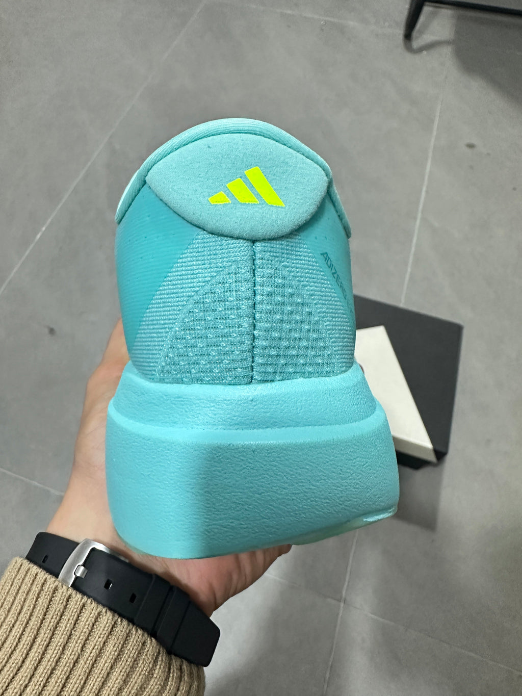 Adidas Lightstrike Pro Running Shoes, in Turquoise and Volt - product image from the listing.