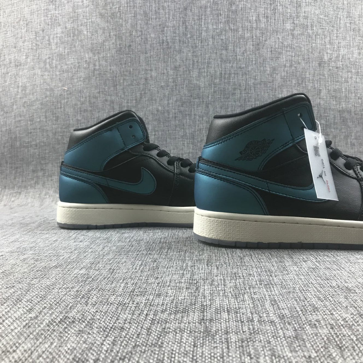 Air Jordan 1 Mid BQ6472-009 Sneakers in Black and Turquoise - product image from the listing.