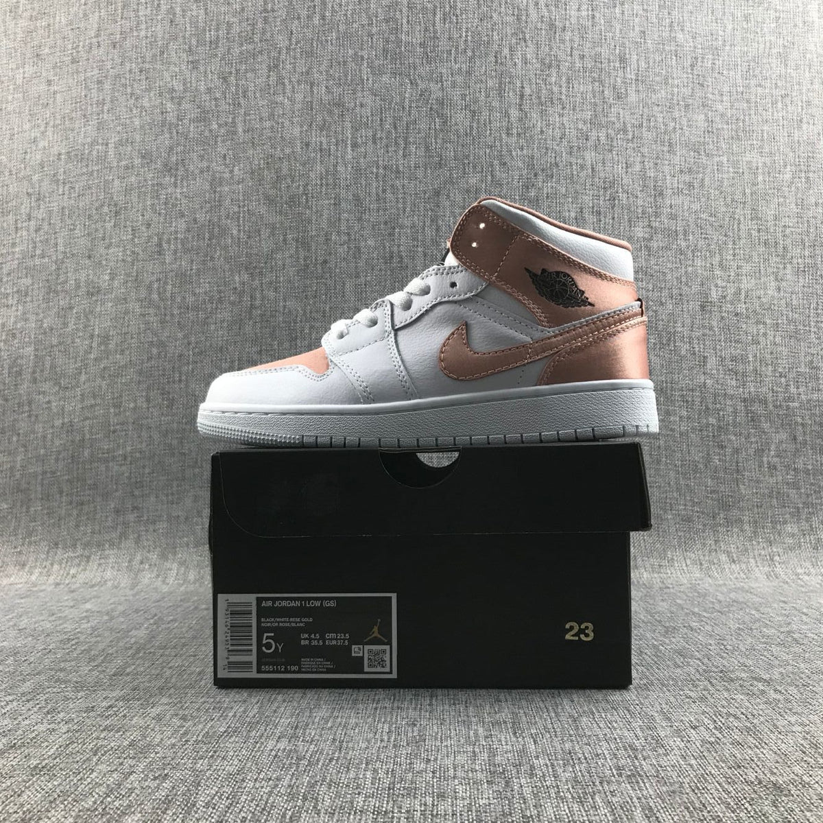 Women's Jordan 1 Mid Rose Gold Silk Sneakers 555112-190 - product image from the listing.