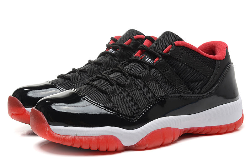 Air Jordan 11 Retro Low Black Red Sneakers - product image from the listing.