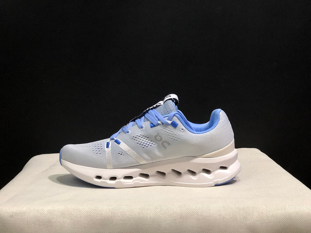 On Cloudsurfer Running Shoes, Heather in White and Blue - product image from the listing.