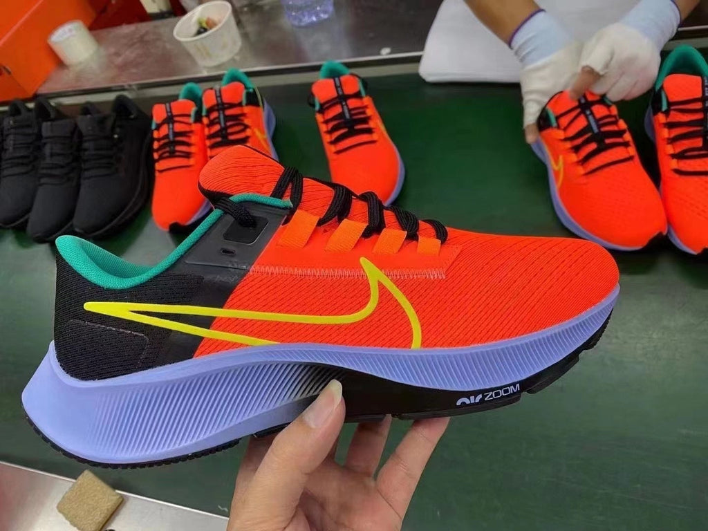 Nike Air Zoom Pegasus 38 Running Shoes in Orange/Black - product image from the listing.