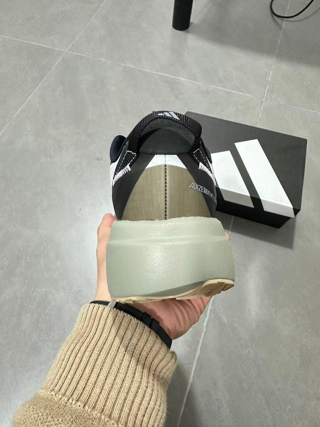Black and White Adidas Adizero SL Running Shoes - product image from the listing.