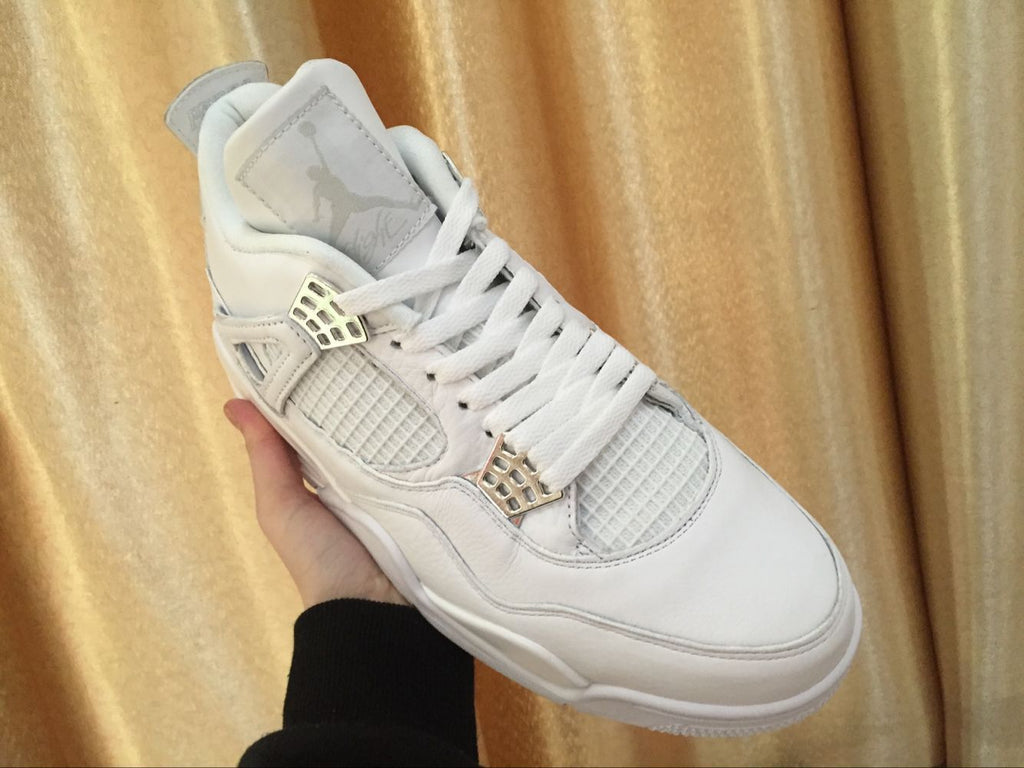 Air Jordan 4 Retro White High-Top Sneakers - product image from the listing.
