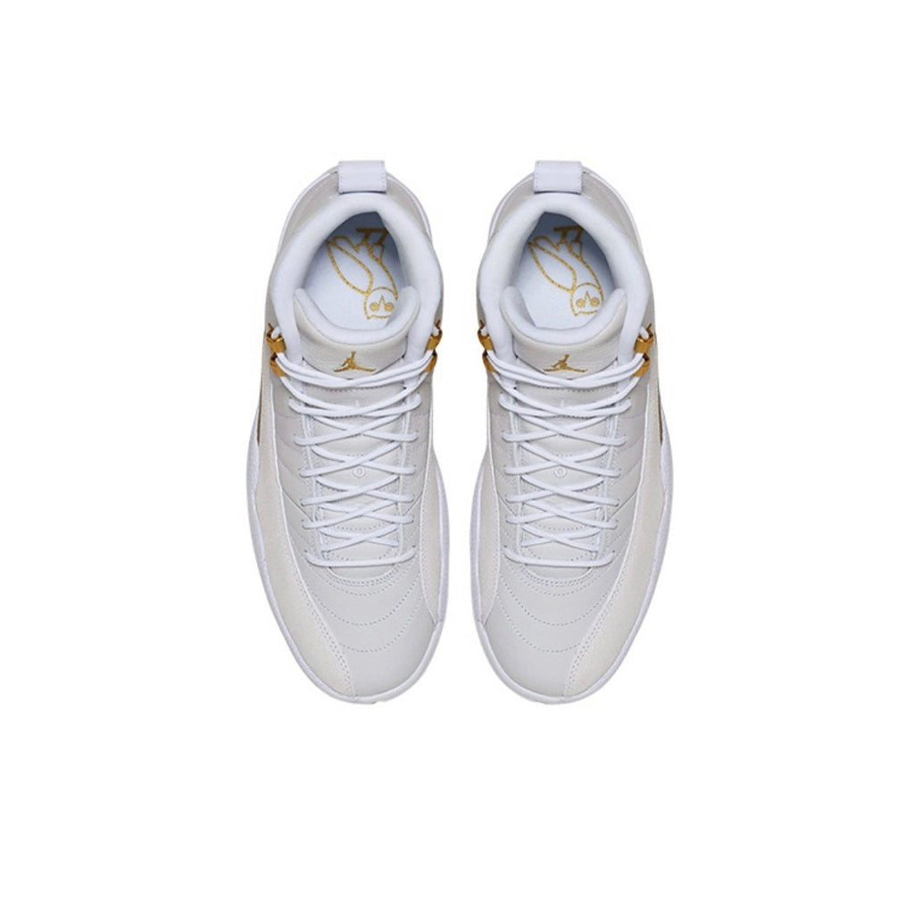 Air Jordan 12 OVO Sneakers in White 873864-102 - product image from the listing.