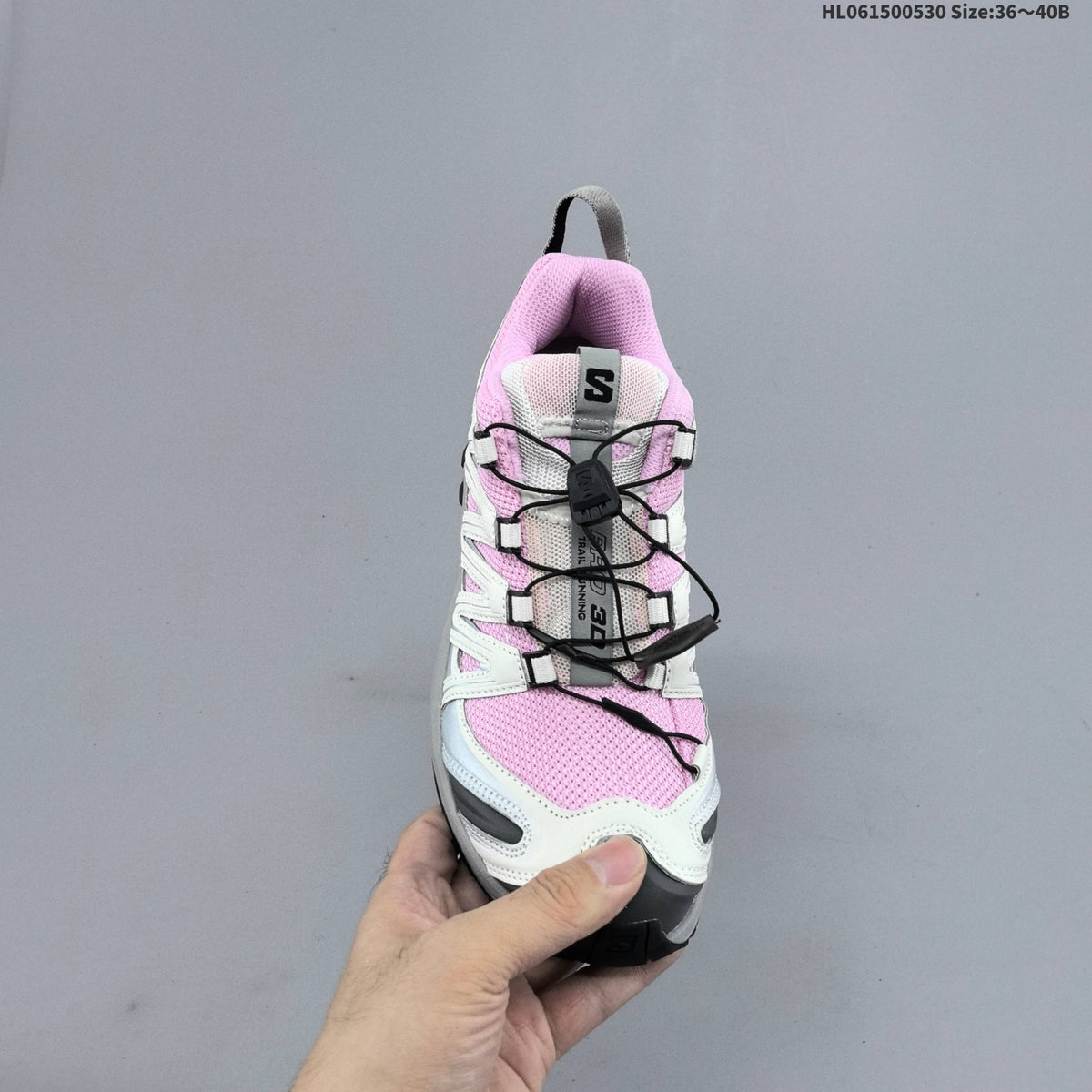 Pink and White Salomon XA PRO 3D Trail Running Shoes - product image from the listing.