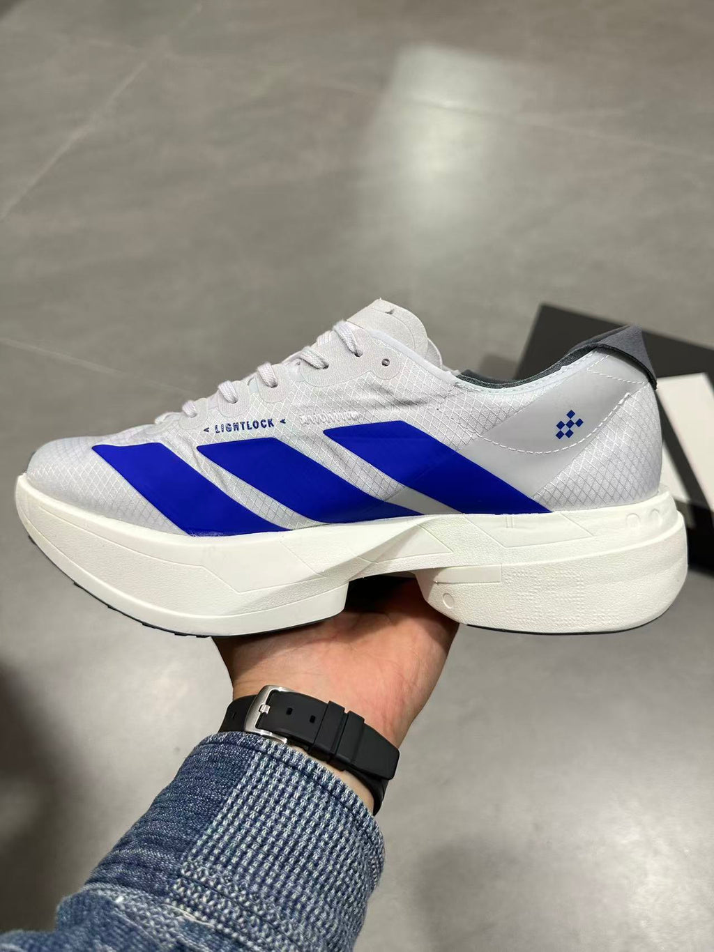 adidas Lightstrike Pro Running Shoes in White Blue - product image from the listing.