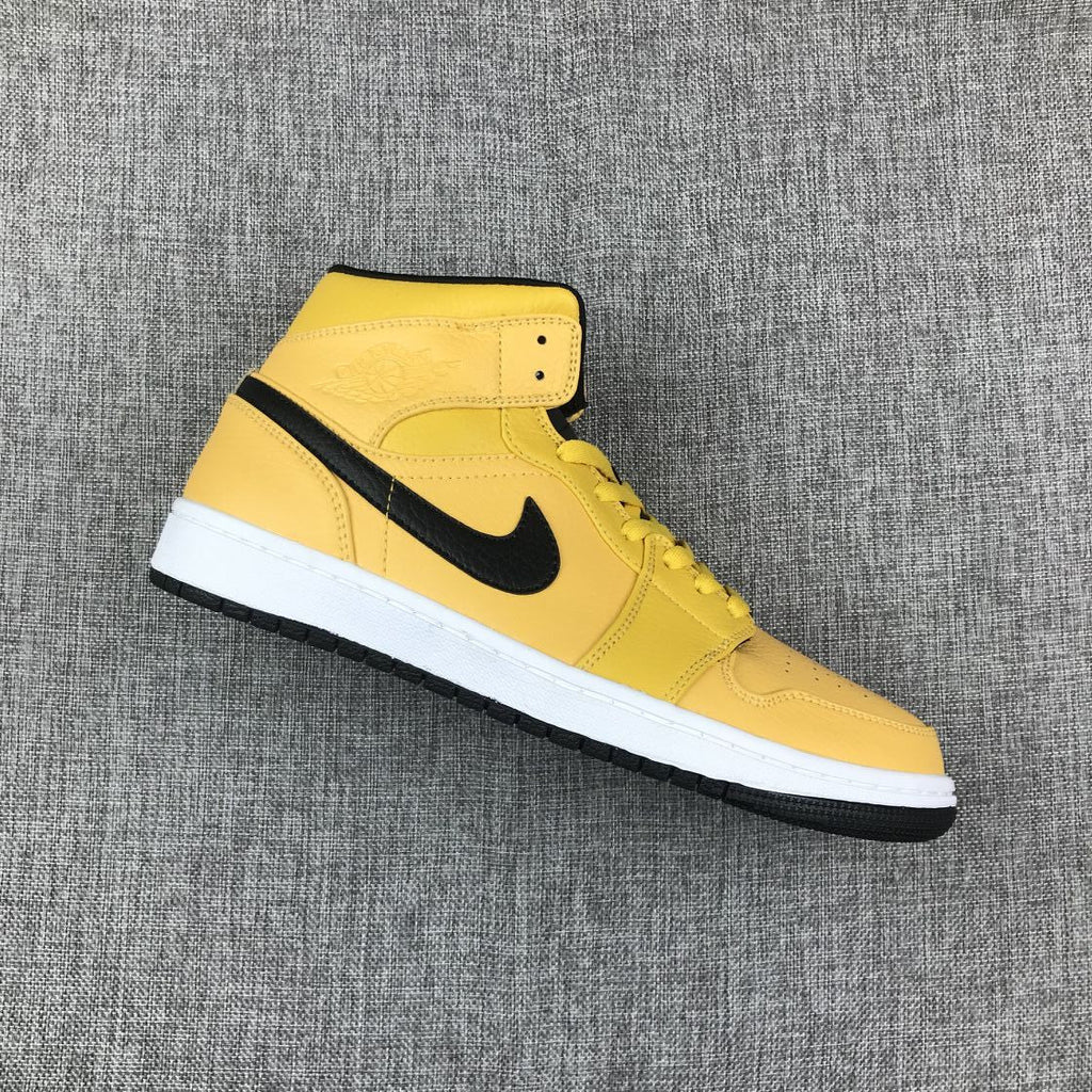 Air Jordan 1 Mid Yellow Ochre Sneakers in Black 554724-700 - product image from the listing.
