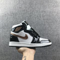 Air Jordan 1 Mid Sneakers in Black White Metallic Gold 852542-007 - product image from the listing.