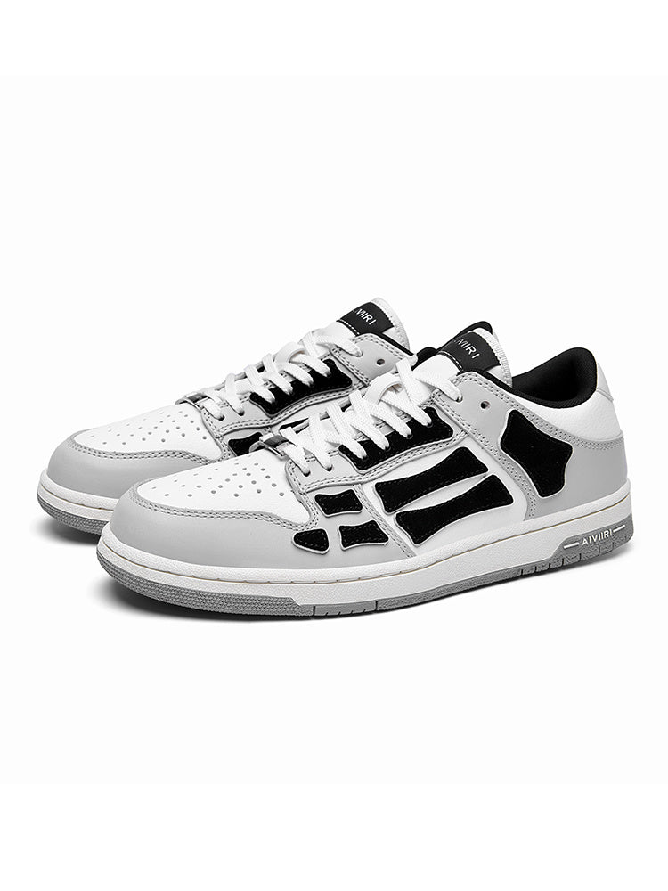 AMIRI Gray and White Low-Cut Sneakers with Black Accents - product image from the listing.