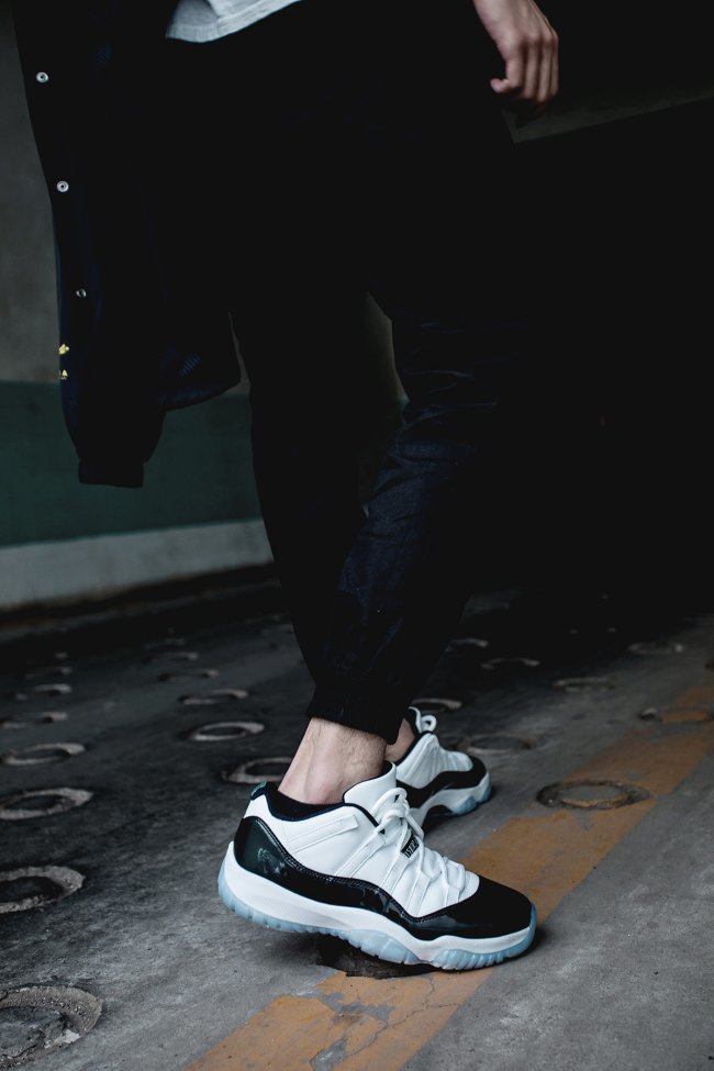 White and Black Air Jordan 11 Iridescent Sneakers - product image from the listing.