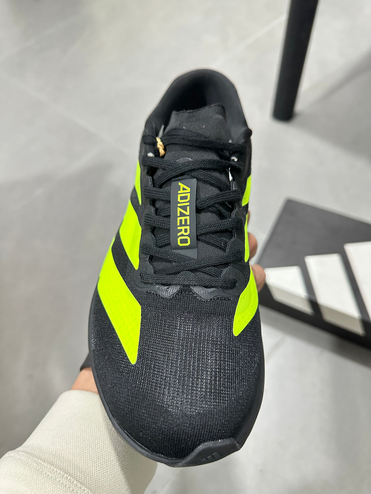 Adidas Adizero Running Shoes in Black and Volt Green JS3420 - product image from the listing.