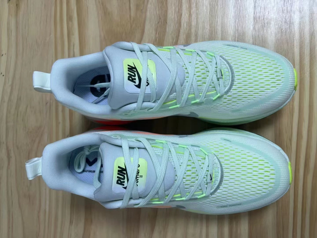 Nike Vomero 18 Running Shoes in Light Blue and Volt - product image from the listing.