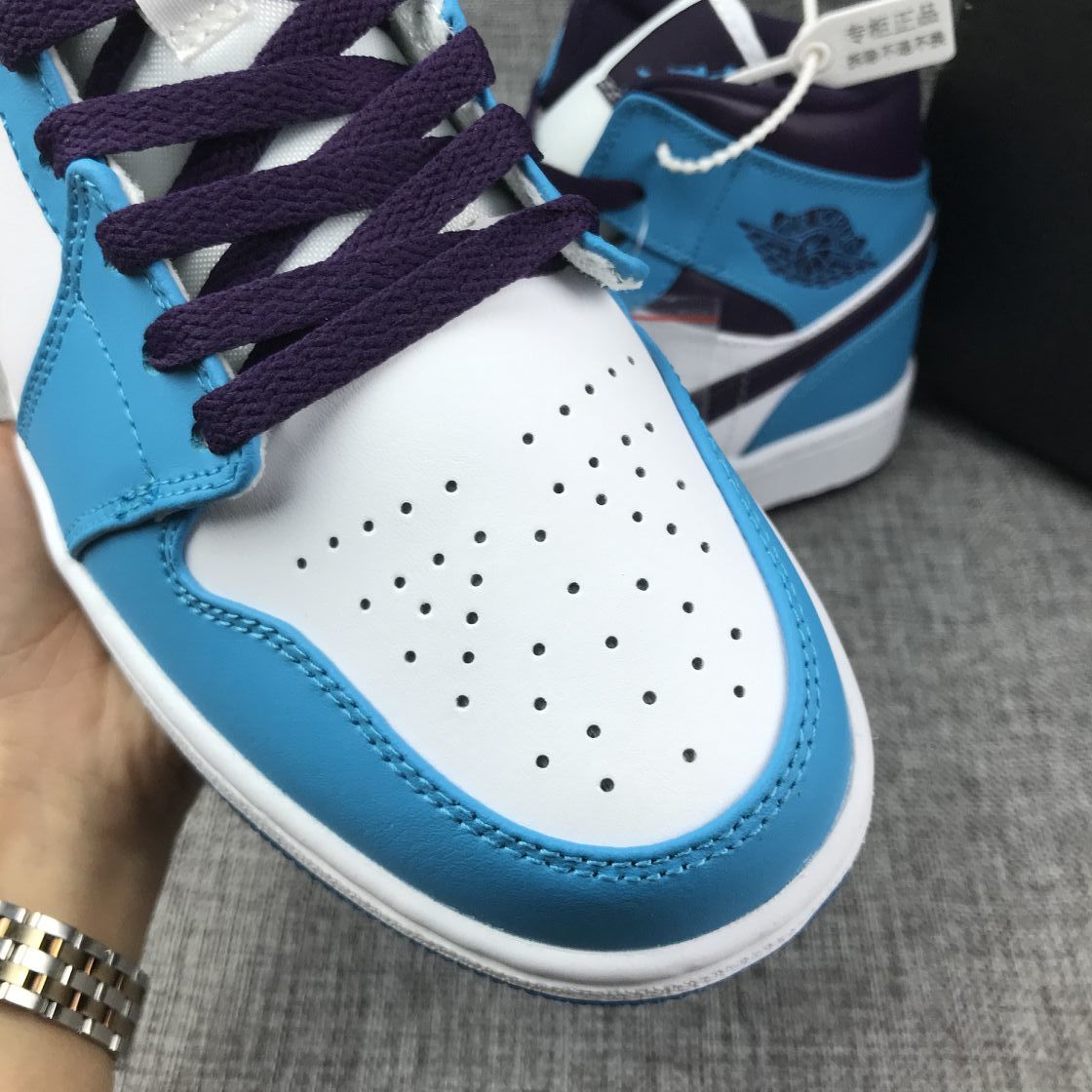 Air Jordan 1 Mid Sneakers in Blue, in White and Black - product image from the listing.