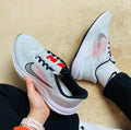 Nike Air Winflo 9 Running Shoes in White and Pink DD6203-009 - product image from the listing.