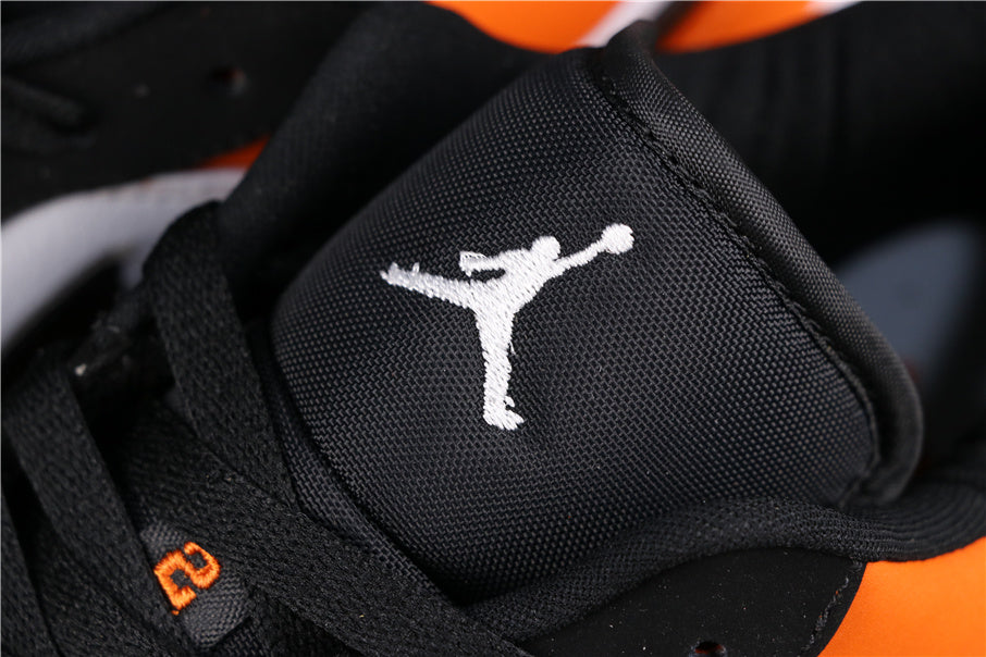 Air Jordan 1 Low Black White Orange Sneakers 553558-128 - product image from the listing.