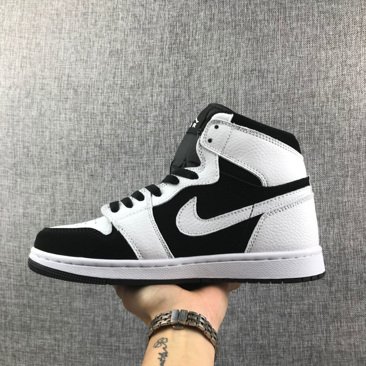 Air Jordan 1 High Sneakers in Black and White 554724-113 - product image from the listing.