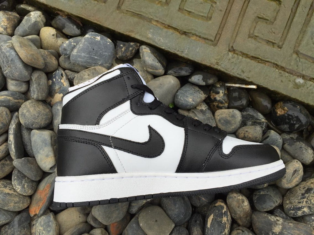 Women's Jordan 1 High Black and White Sneakers - product image from the listing.