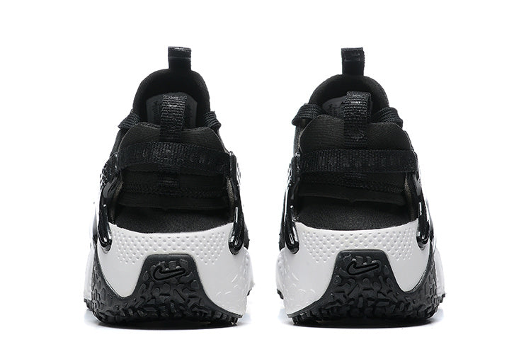 Nike Air Huarache Sneakers in Black and White - product image from the listing.