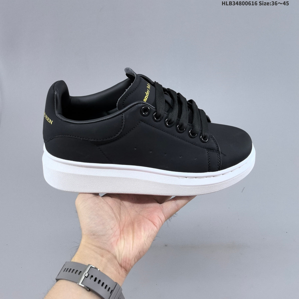Alexander McQueen Oversized Low-Top Sneakers, in White and Black - product image from the listing.