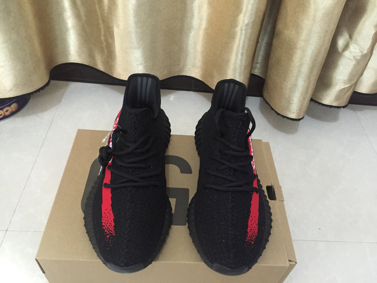 Yeezy 350 V2 Sneakers in Black and Red Knit - product image from the listing.