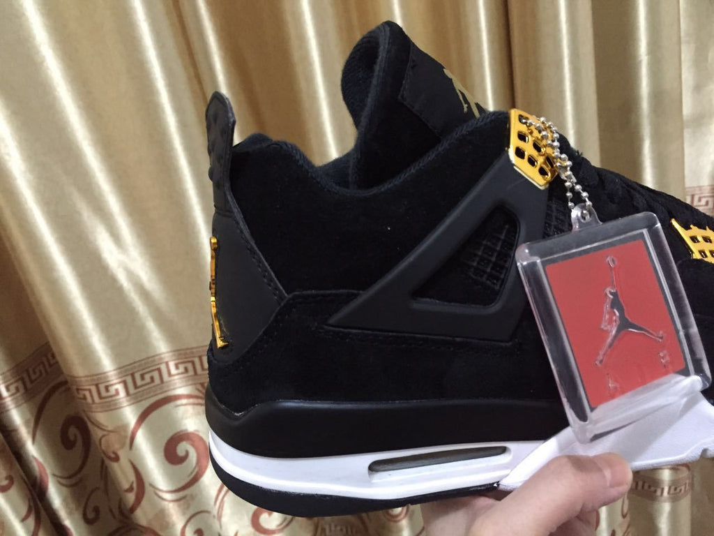 Jordan 4 High-Top Sneakers in Black and Gold - product image from the listing.