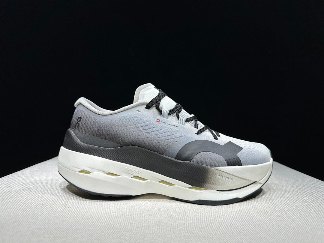 On Cloudboom Max Running Shoes, in White and Black - product image from the listing.