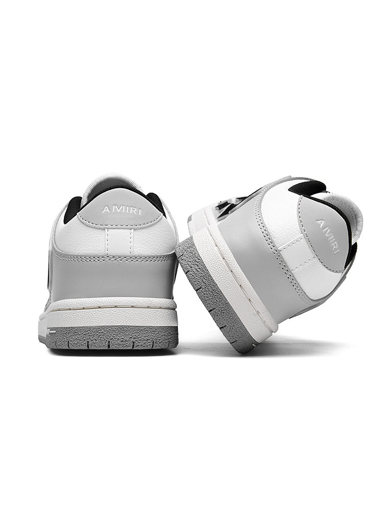 AMIRI Gray and White Low-Cut Sneakers with Black Accents - product image from the listing.