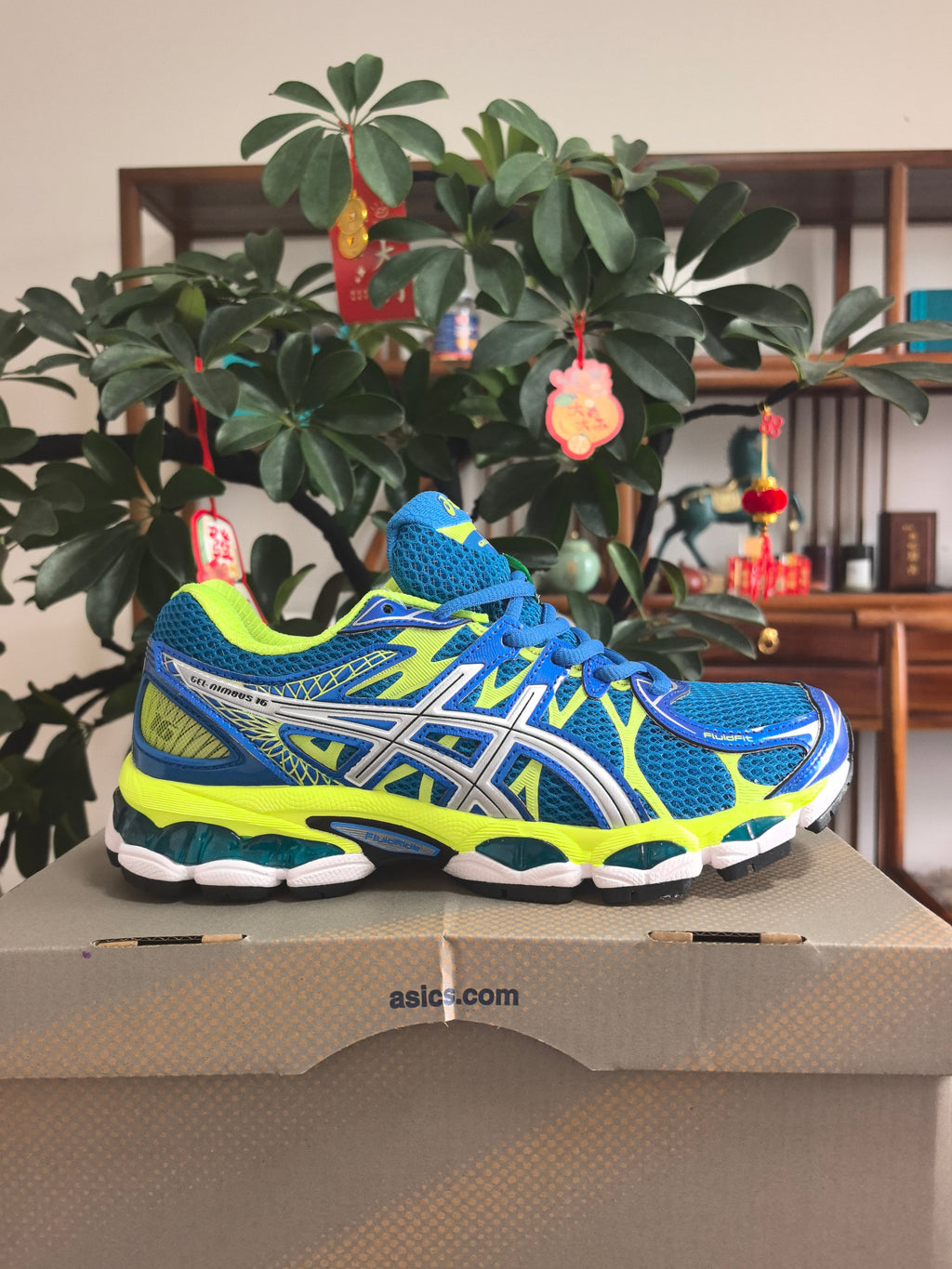 ASICS GEL-NIMBUS 16 Sneakers, Blue and Neon in Yellow - product image from the listing.