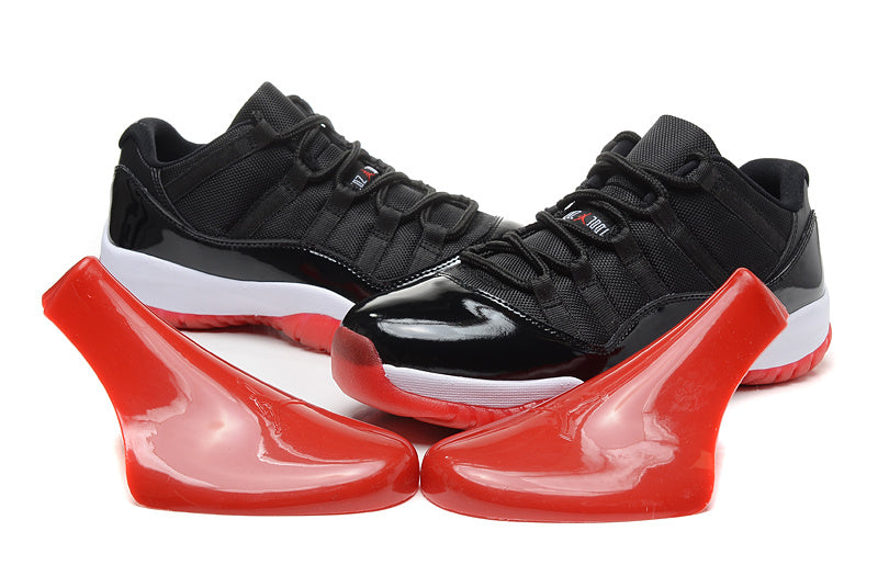 Air Jordan 11 Retro Low Black and Red Sneakers - product image from the listing.