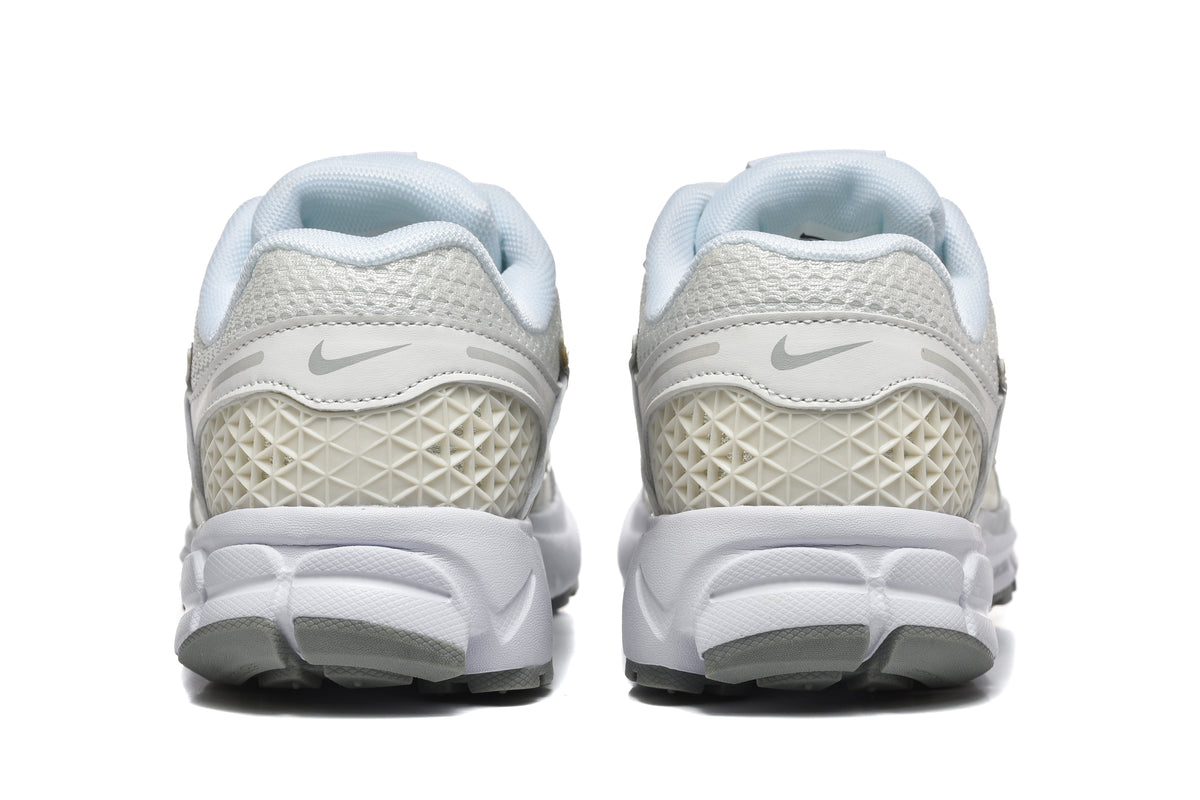 White and Silver Nike Vomero 5 Sneakers - product image from the listing.