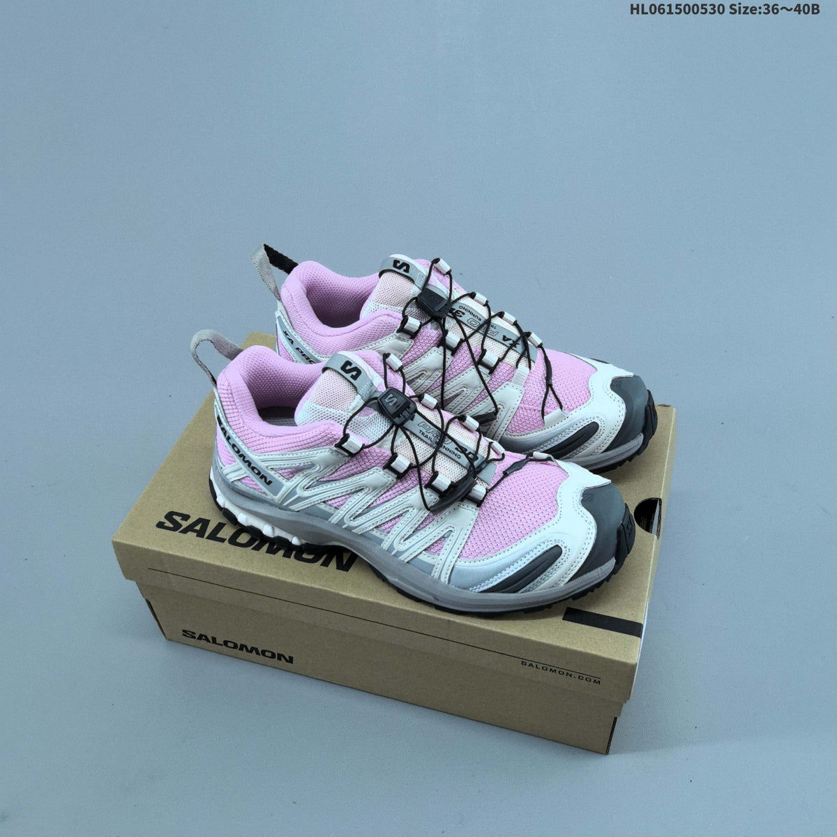Pink and White Salomon XA PRO 3D Trail Running Shoes - product image from the listing.
