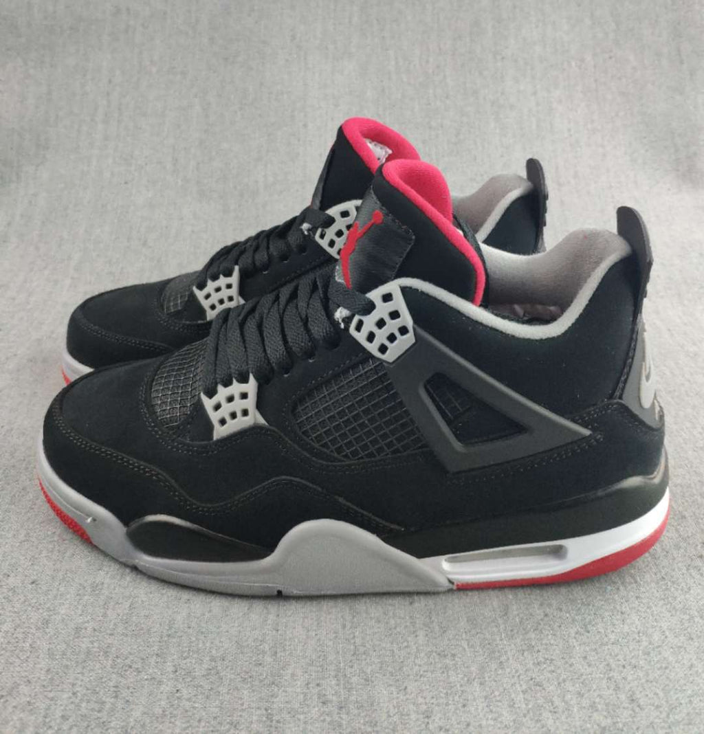 Jordan 4 Retro Sneaker in Black, in Red and White - product image from the listing.