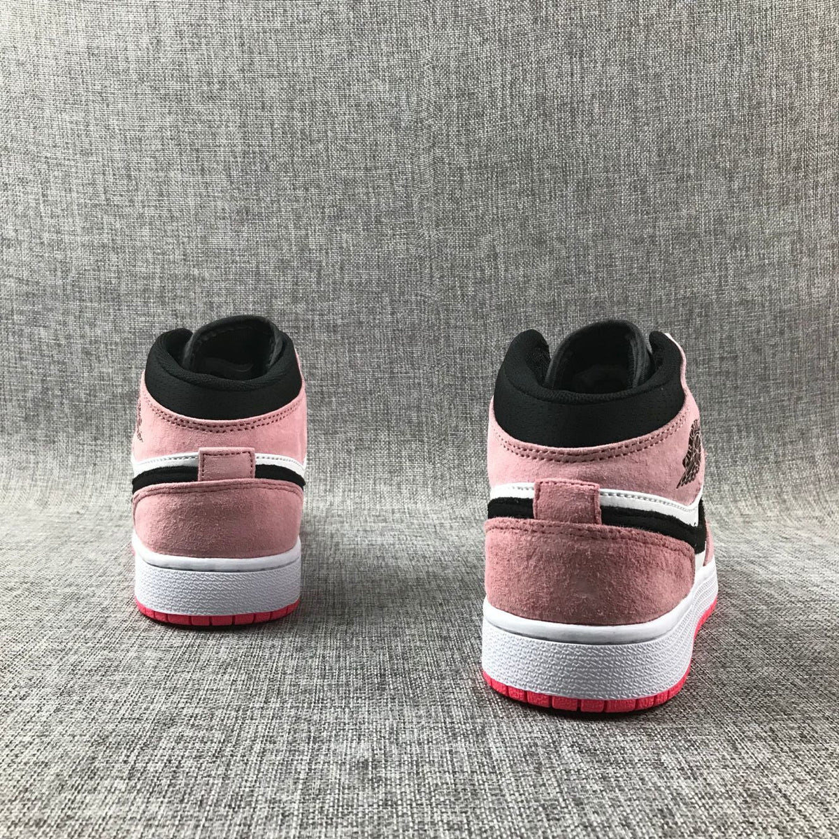 Air Jordan 1 Mid Sneakers in Pink 852542-801 - product image from the listing.
