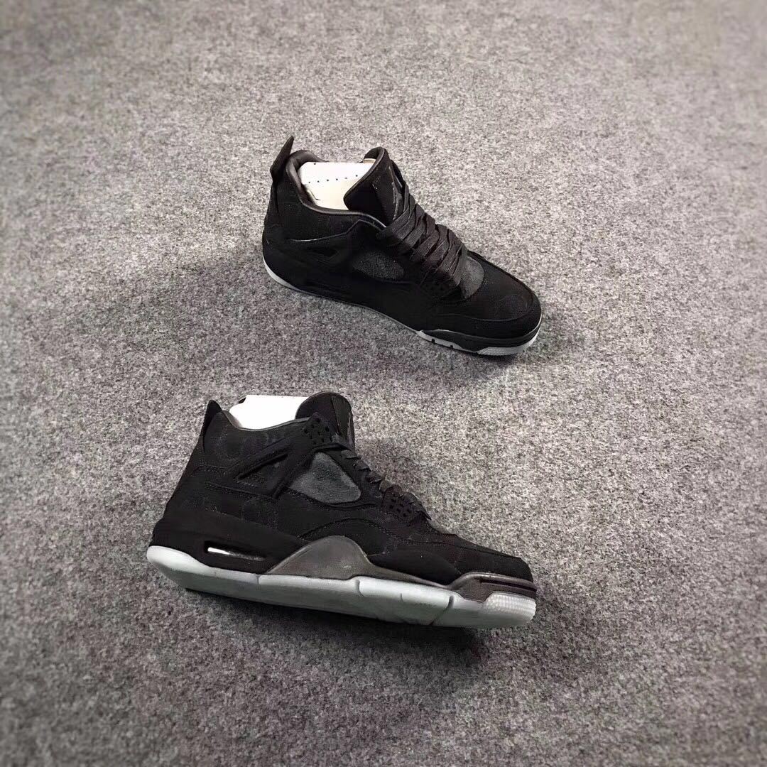 Jordan 4 KAWS Graffiti High-Top Sneakers in Black - product image from the listing.
