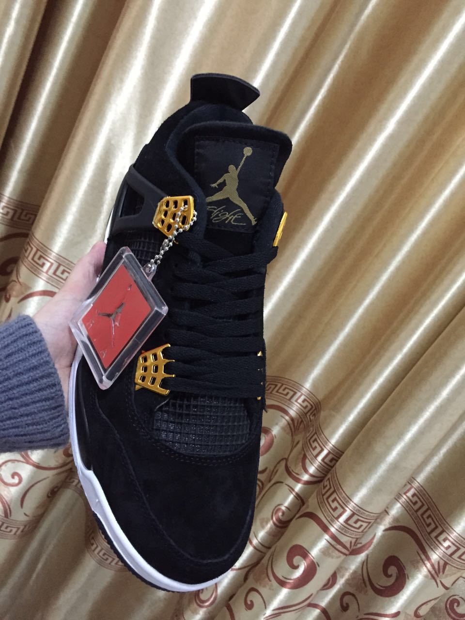 Jordan 4 High-Top Sneakers in Black and Gold - product image from the listing.