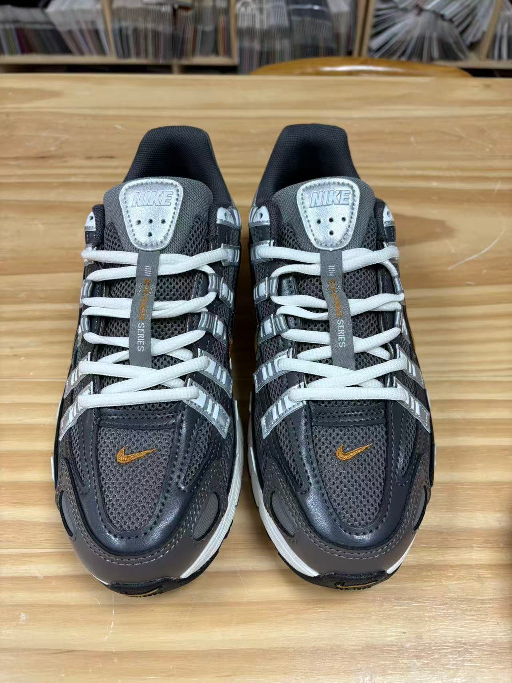 Nike P-6000 Sneakers CD6404-204 in Charcoal and White - product image from the listing.