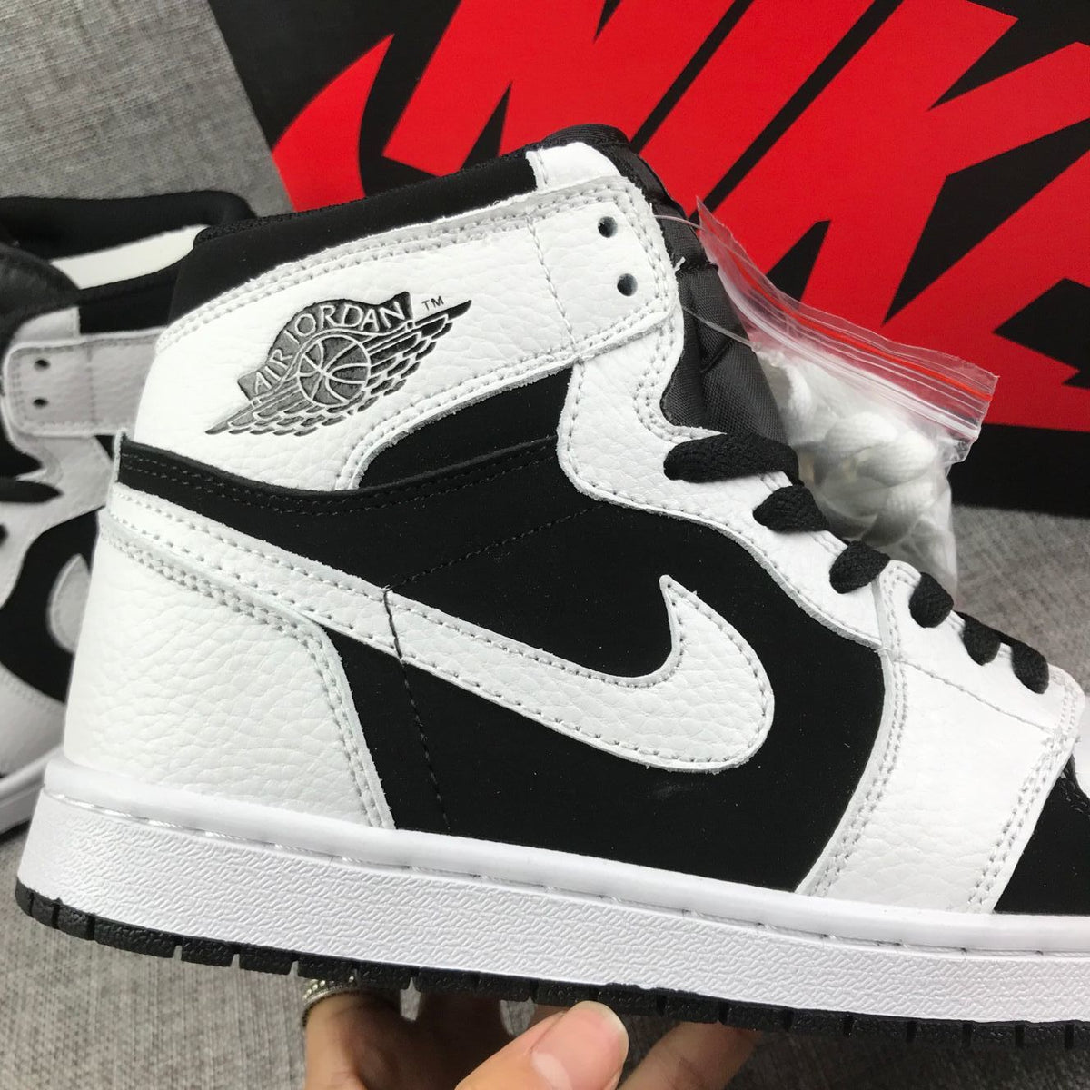 Air Jordan 1 High Sneakers in Black and White 554724-113 - product image from the listing.
