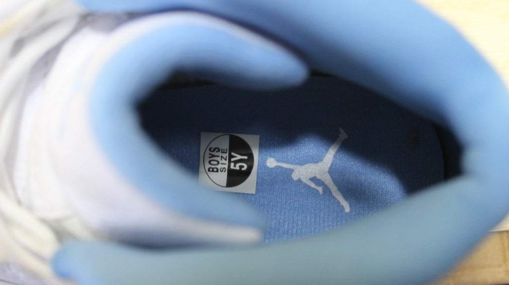 Air Jordan 12 High-Top Sneakers in University Blue 510815-127 - product image from the listing.