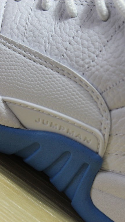 Air Jordan 12 High-Top Sneakers in University Blue 510815-127 - product image from the listing.