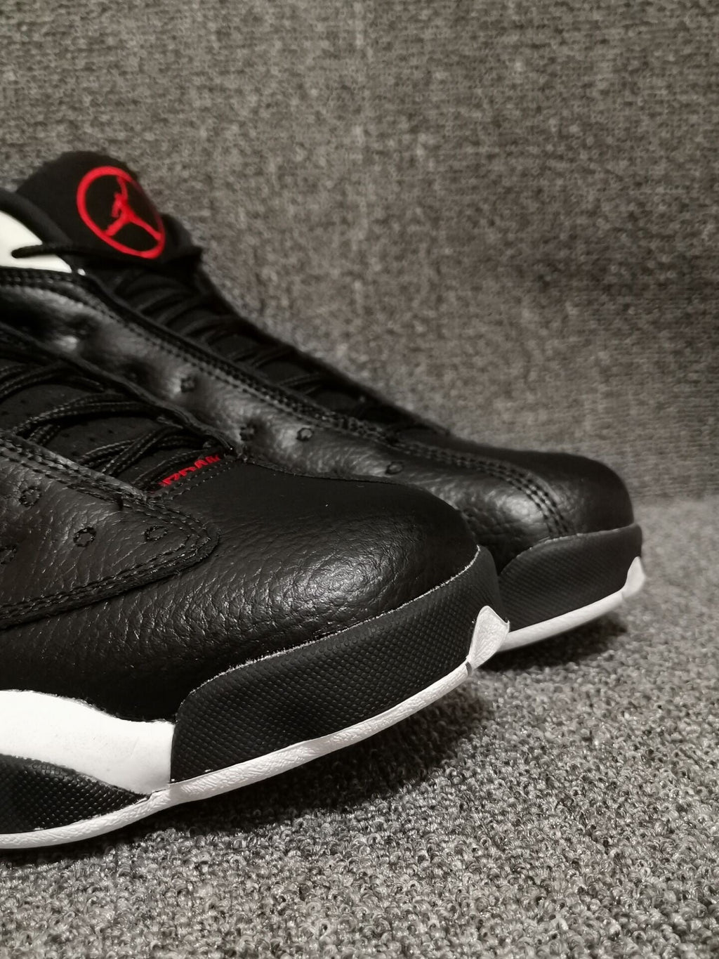 Air Jordan 13 Retro Black Red White Sneakers - product image from the listing.