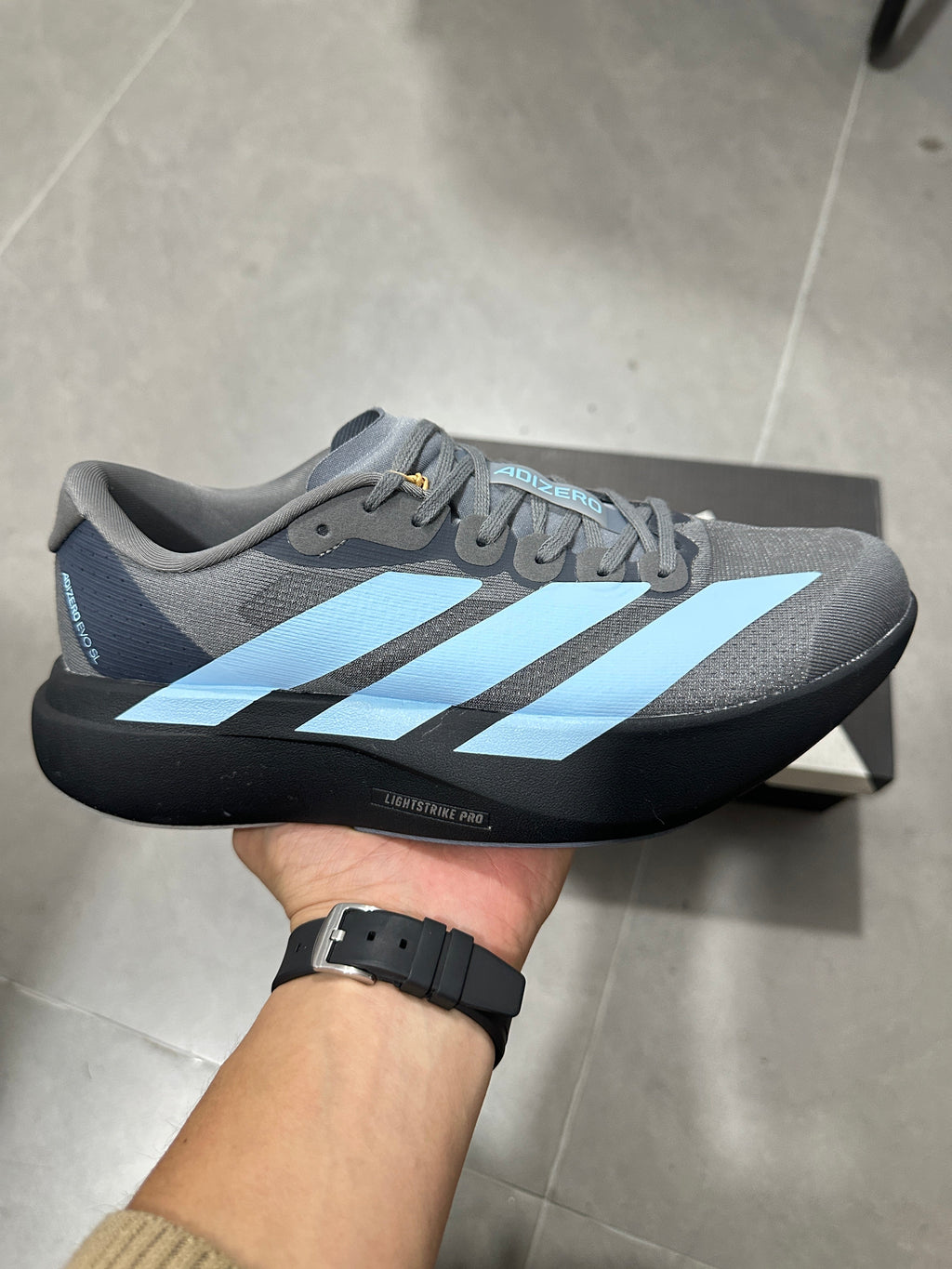 Grey and Blue Adizero Lightstrike Pro Running Shoes - product image from the listing.