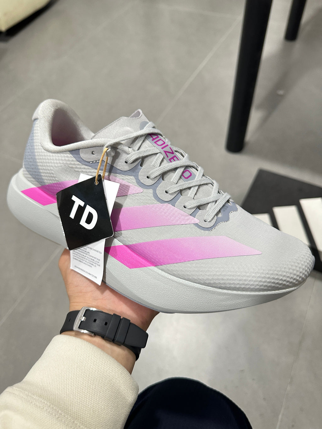 adidas Adizero Lightstrike Pro Running Shoes, in Gray and Pink - product image from the listing.
