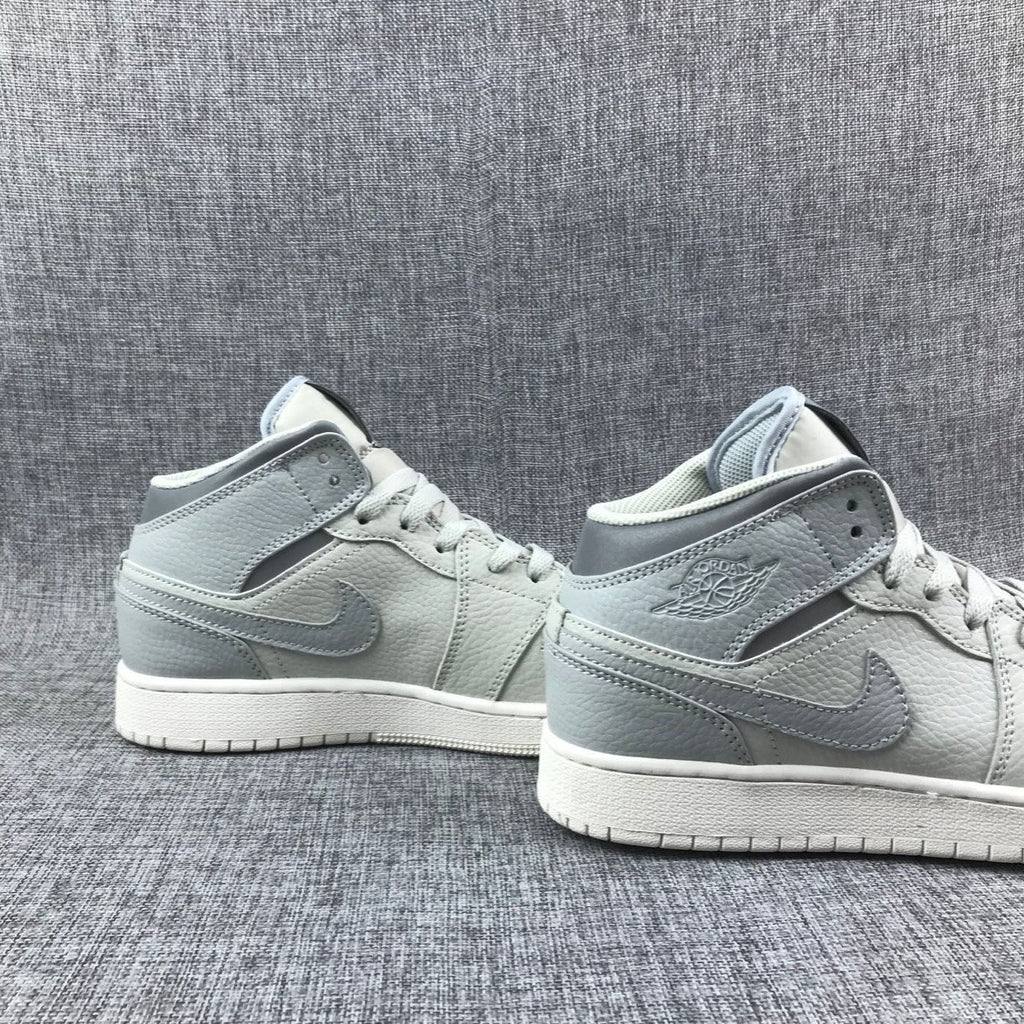 White and Grey Air Jordan 1 Mid Sneakers - product image from the listing.