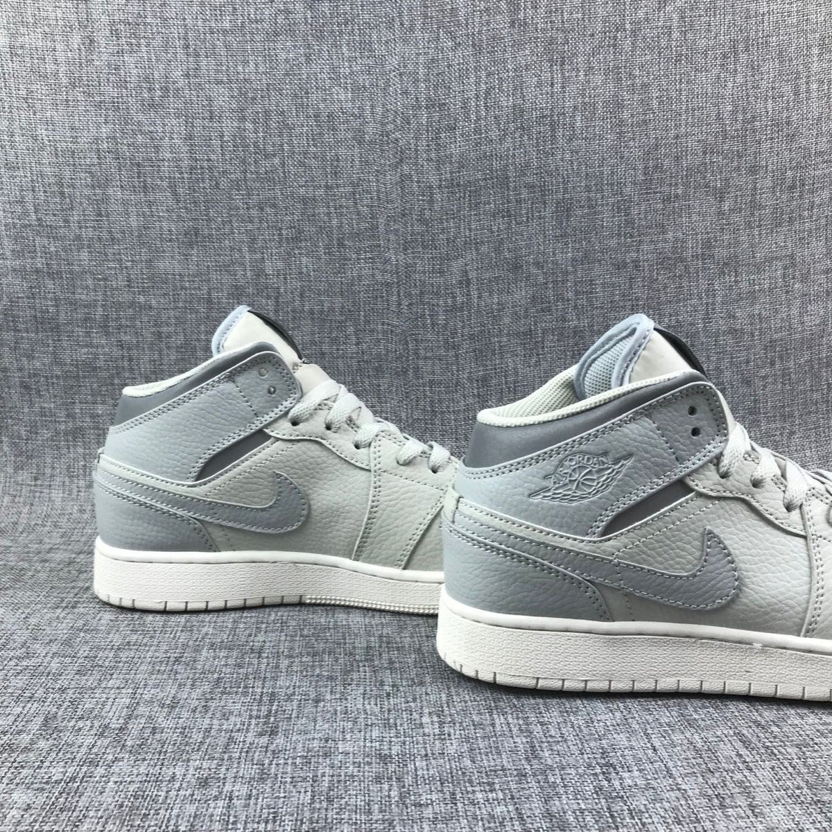 White and Grey Air Jordan 1 Mid Sneakers - product image from the listing.