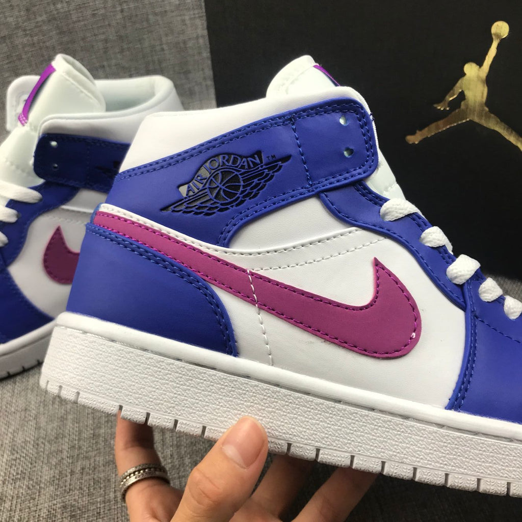 Air Jordan 1 Mid Sneakers in Blue Pink 554724-451 - product image from the listing.