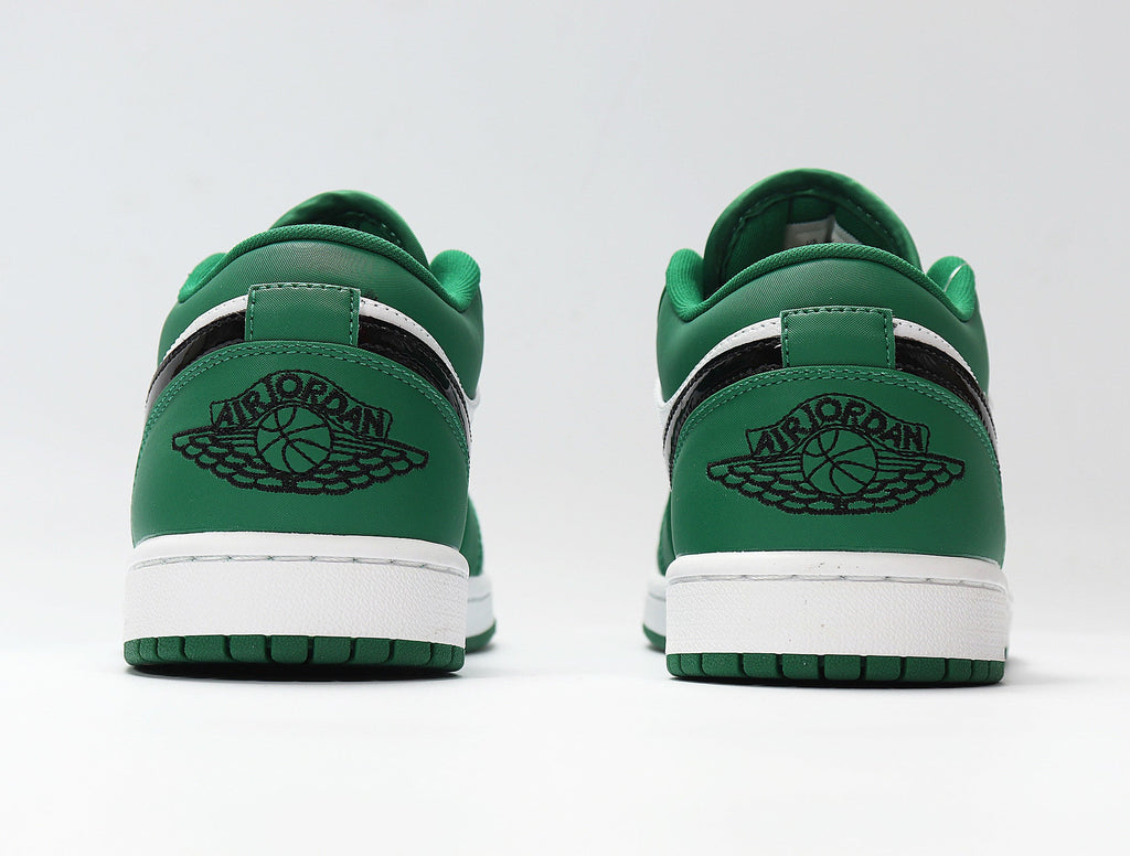 Jordan 1 Low Sneakers in White and Green 553558-301 - product image from the listing.