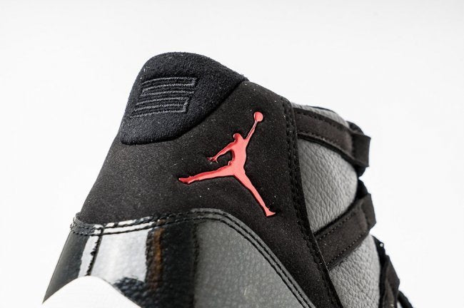 Air Jordan 11 Retro 72-10 High-Top Sneakers in Black and White - product image from the listing.