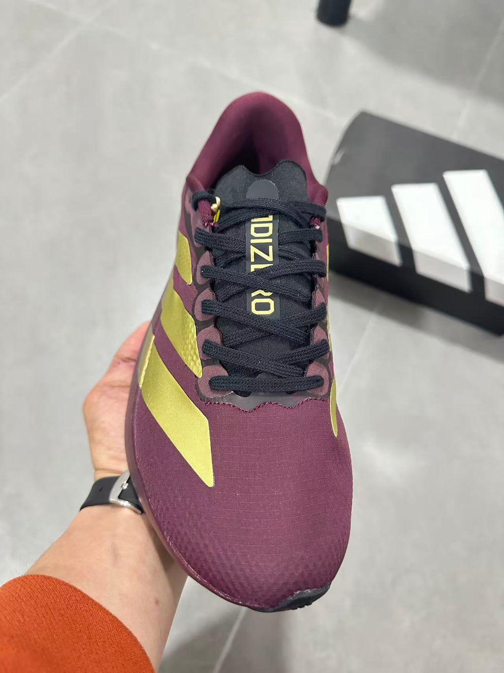 Adidas Lightstrike Pro Running Shoes in Burgundy Gold JQ4443 - product image from the listing.