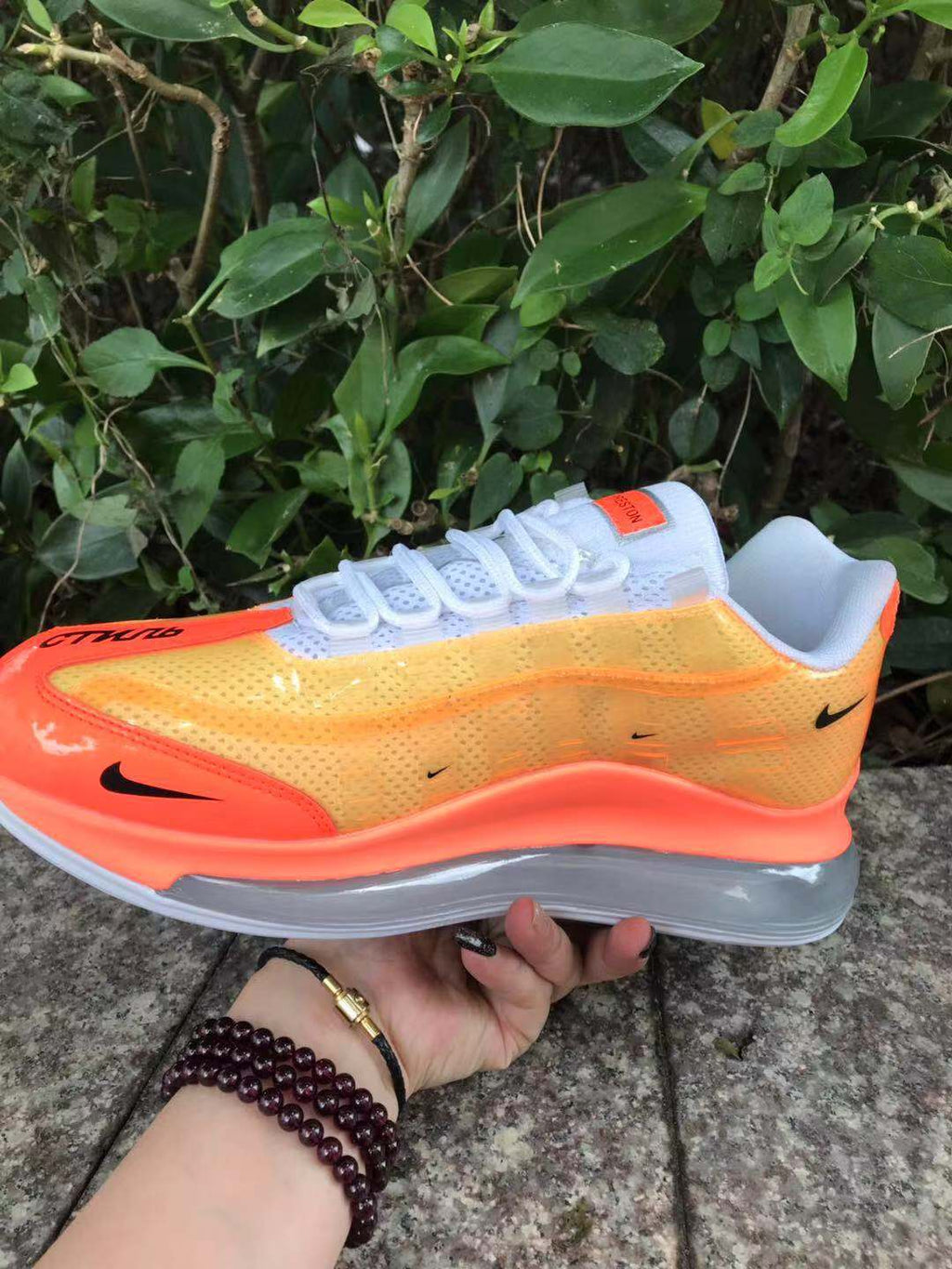 Orange and Yellow Nike Air Max 720 Sneakers - product image from the listing.